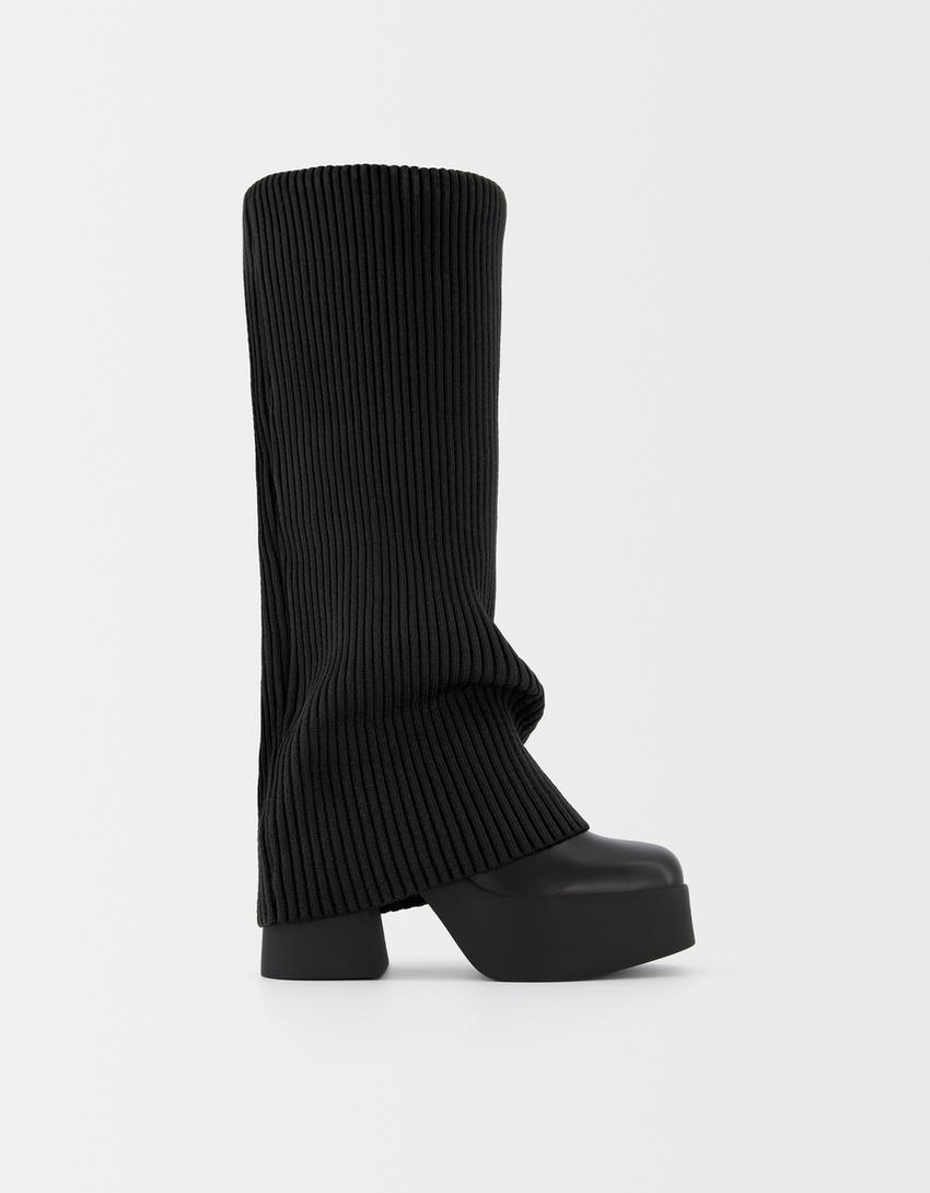 High-heeled platform boots with stocking detail