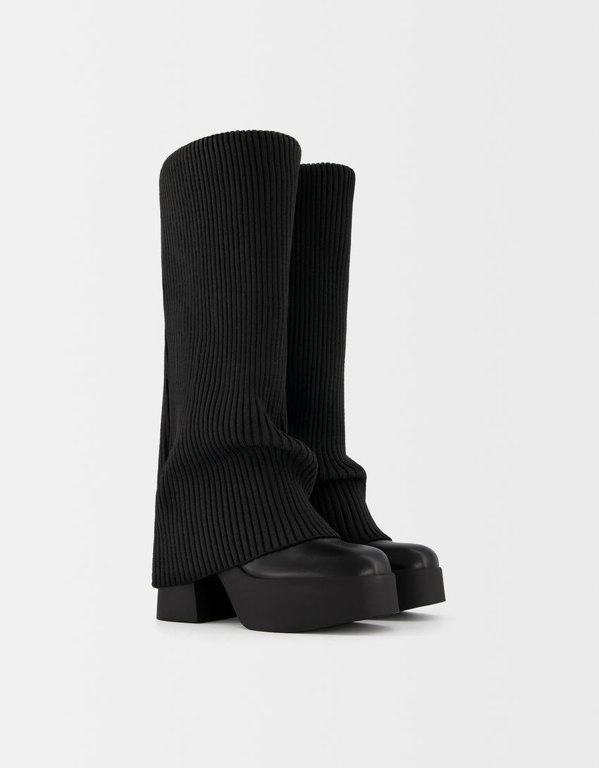 High-heeled platform boots with stocking detail